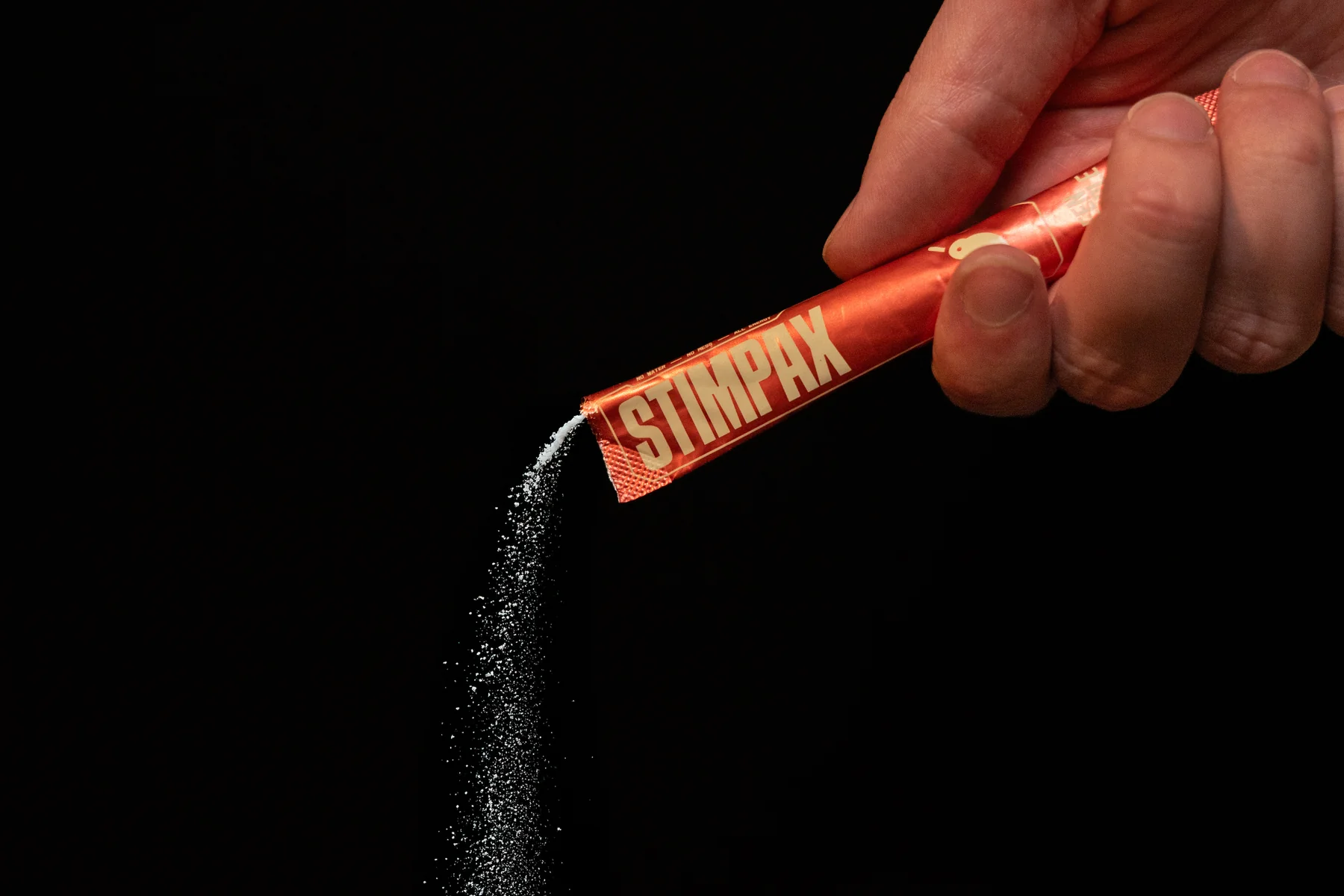 Stim Pax powder pouring from an opened stick